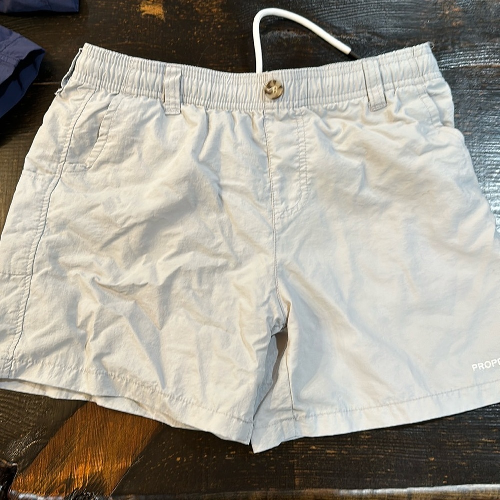 Properly tied youth, large shorts, quick, dry material